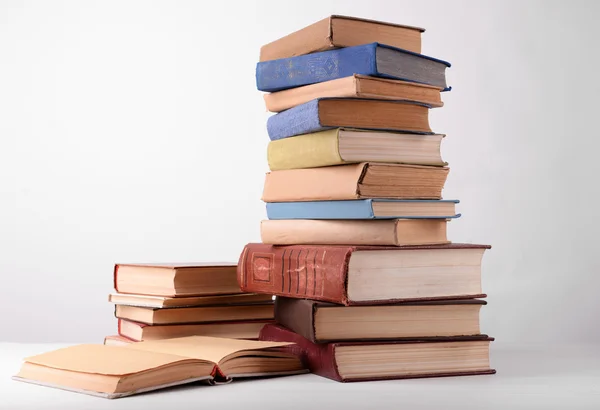 Heap of books on grey background — Stock Photo, Image