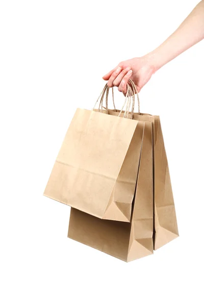 Ręka trzyma papieru torby na zakupy — Zdjęcie stockowe