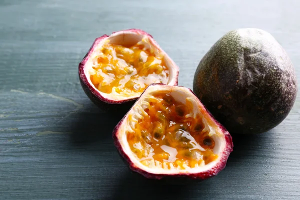 Passion fruits on wooden background — Stock Photo, Image