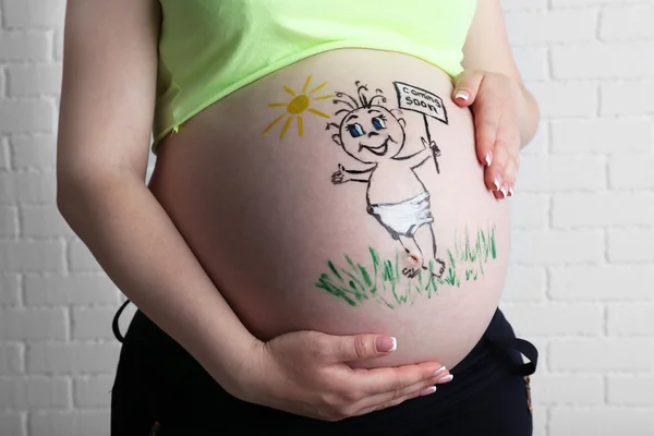 Kroppskonst på magen av gravid kvinna på ljus bakgrund — Stockfoto