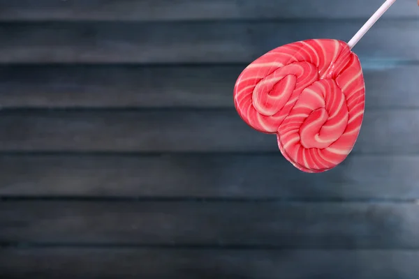 Bright lollipop in shape of heart — Stock Photo, Image