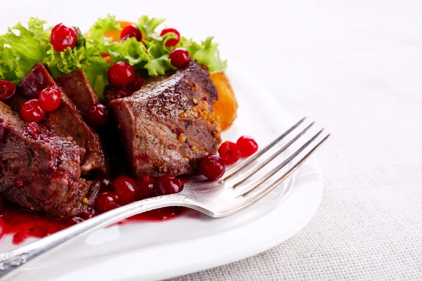 Tasty roasted meat with cranberry sauce — Stock Photo, Image