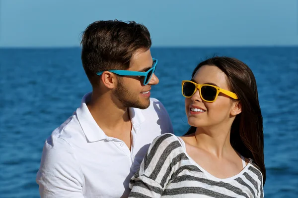 Beautiful young couple on beach — Stock Photo, Image