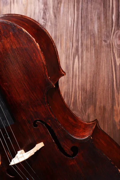 Vintage cello on wooden background — Stock Photo, Image