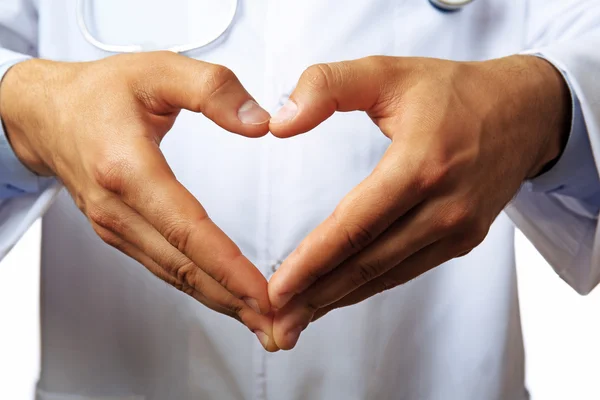 Las manos del doctor haciendo forma de corazón —  Fotos de Stock