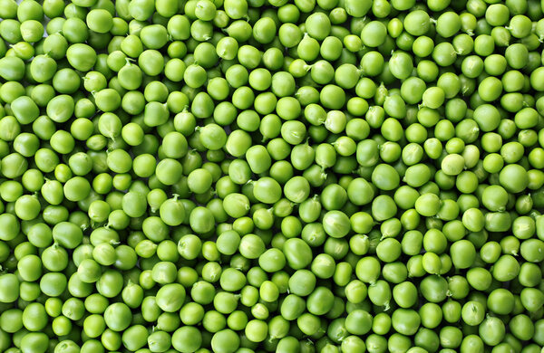 Heap of fresh green peas close up