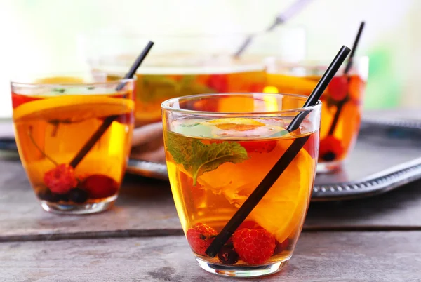 Fruity punch in glassware on metal tray, closeup — Stock Photo, Image