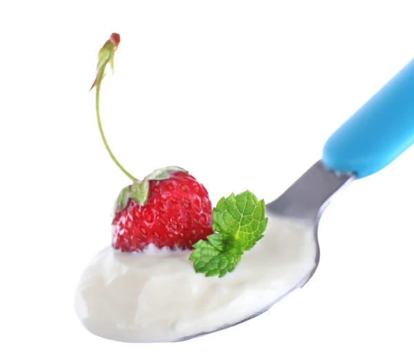 Delicious yogurt in spoon with strawberry and mint isolated on white — Stock Photo, Image