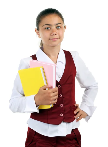 Beautiful little girl in school uniform isolated on white — Stock Photo, Image