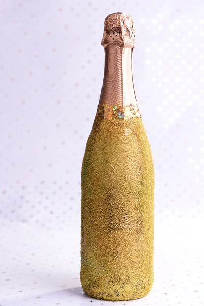 Bottle of champagne on bright background — Stock Photo, Image