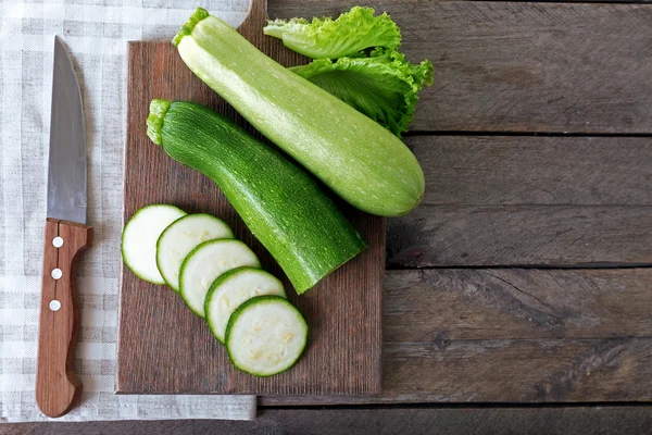 Fresh zucchini with squash on cutting board — Stock Photo, Image