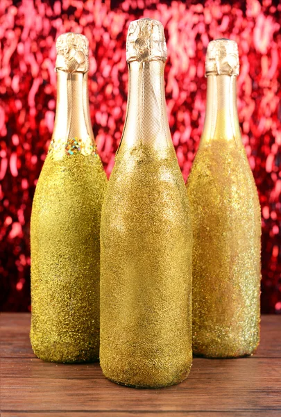 Flaskor champagne på ljus bakgrund — Stockfoto