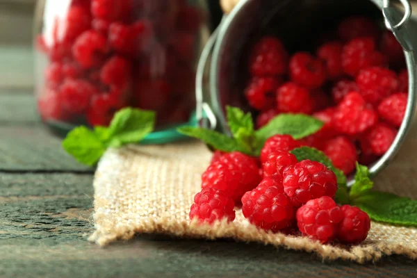 Sweet raspberries in decorative bucket — Stock Photo, Image