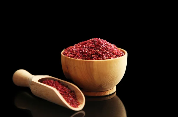 Sumac in wooden bowl — Stock Photo, Image