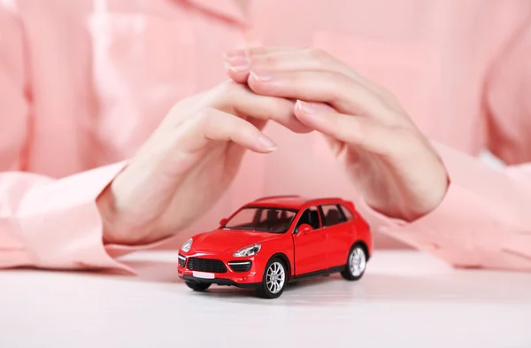Hands and toy car — Stock Photo, Image