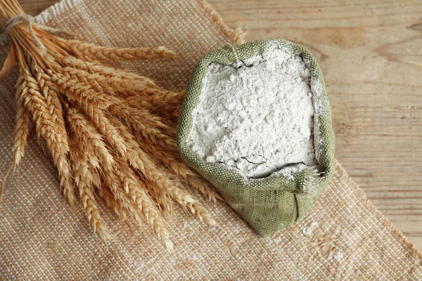 Flour with wheat ears — Stock Photo, Image