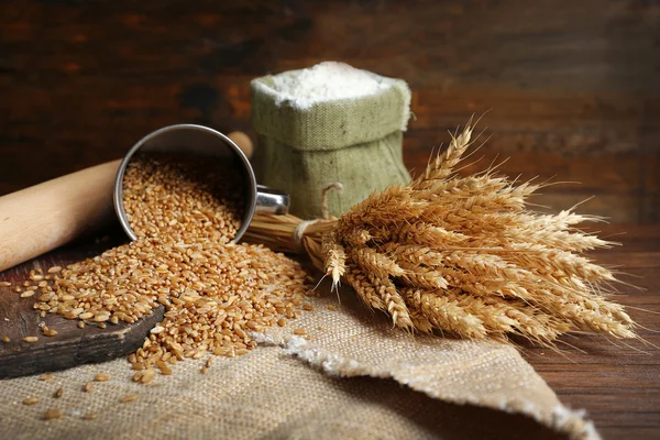 Flour and wheat on wooden background — Stock Photo, Image