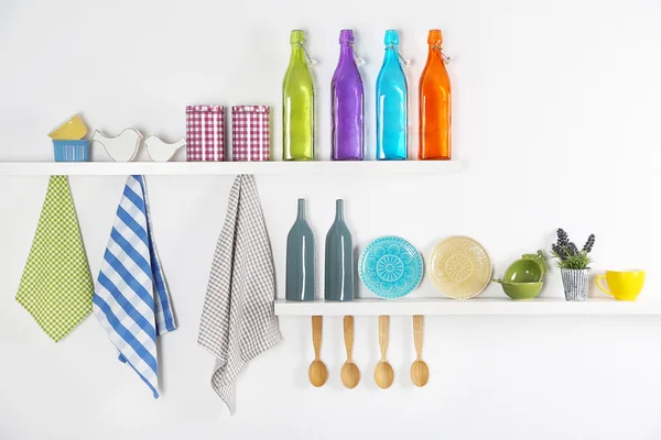 Kitchen utensils on wooden shelves, close up — Stock Photo, Image