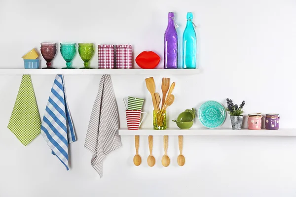 Kitchen utensils on wooden shelves, close up — Stock Photo, Image