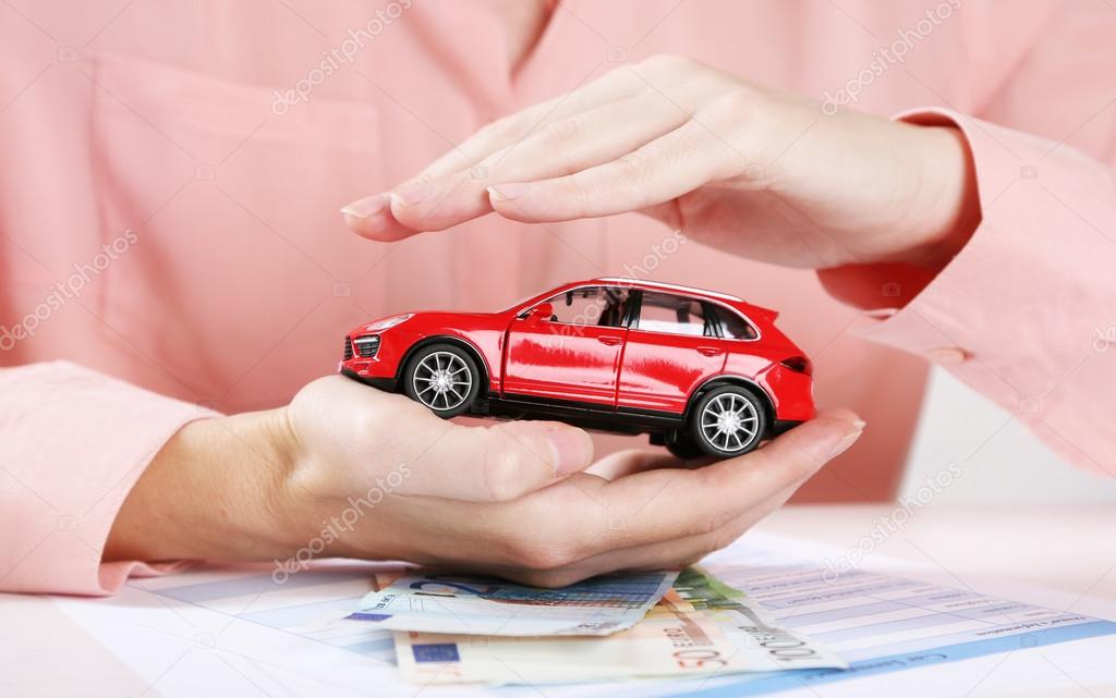 Hands and toy car