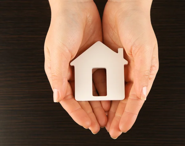 Female hands with model of house — Stock Photo, Image