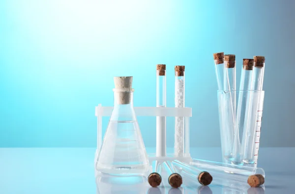 Empty laboratory test tubes  on blue background — Stock Photo, Image