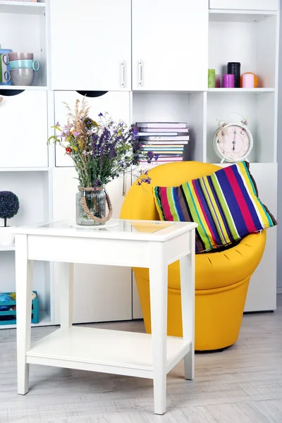 White living room with armchair and bookcase — Stock Photo, Image