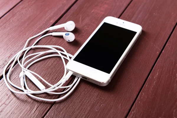 Telefone celular e fones de ouvido — Fotografia de Stock