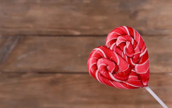 Bright lollipop in shape of heart — Stock Photo, Image