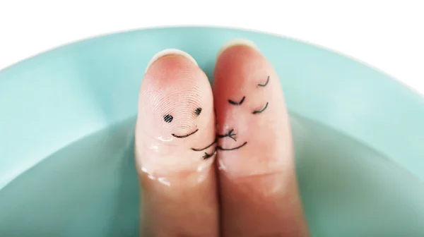 Fingers with funny smiles in pool — Stock Photo, Image