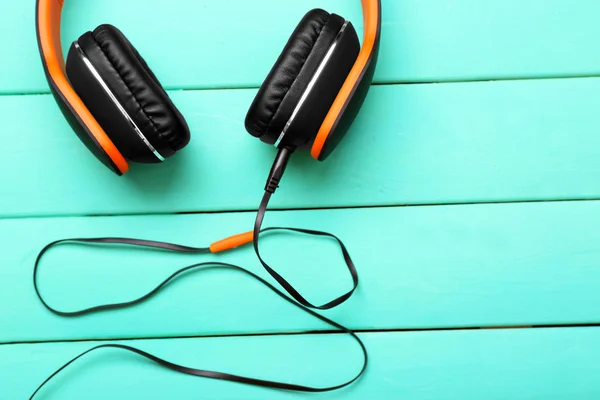 Headphones on wooden background — Stock Photo, Image