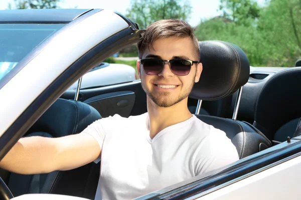 Young man in cabriolet — Stock Photo, Image