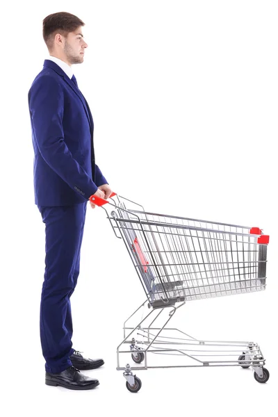 Young man with empty shopping cart — Stock Photo, Image