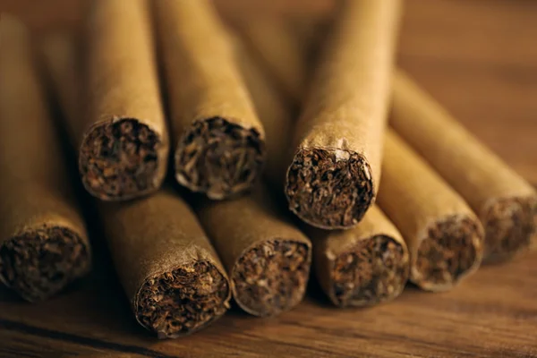 Cigars on wooden table — Stock Photo, Image