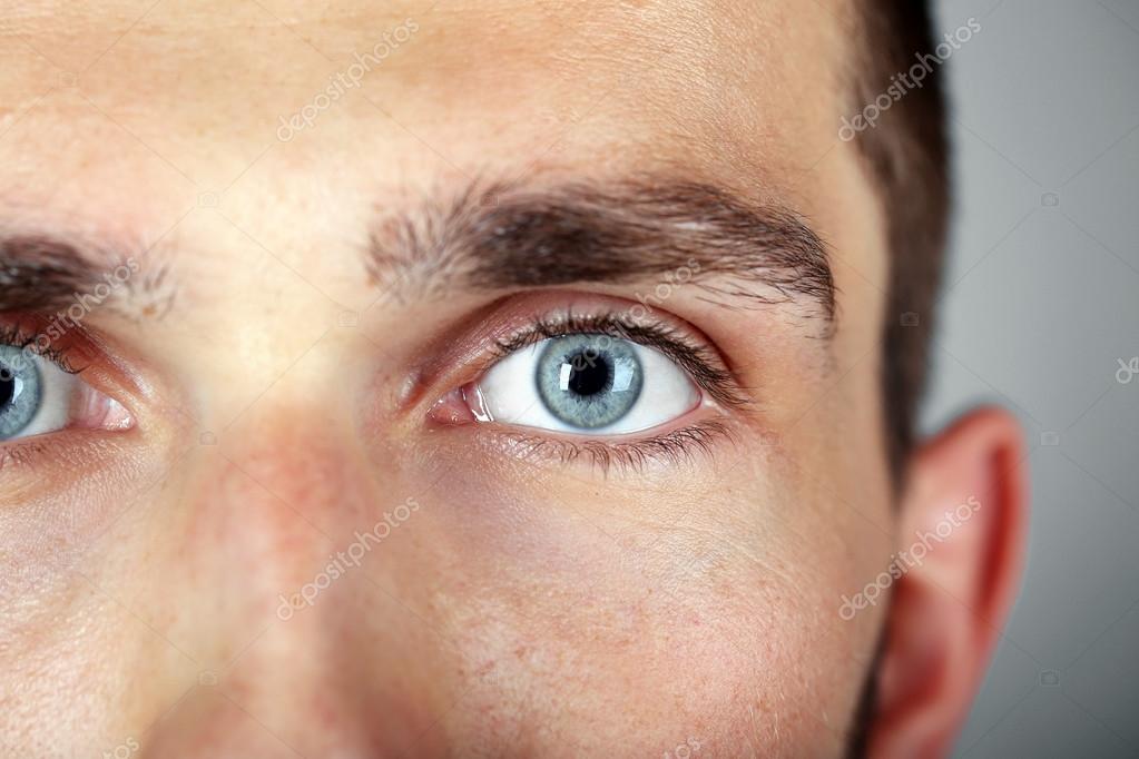 Close-up Shot Of Man's Eye. Man With Blue Eyes. Stock Photo