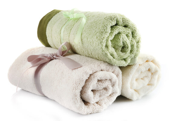 Rolled up colorful towels isolated on white