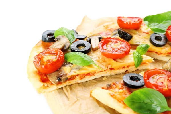 Tasty pizza with vegetables and basil on cutting board close up — Stock Photo, Image