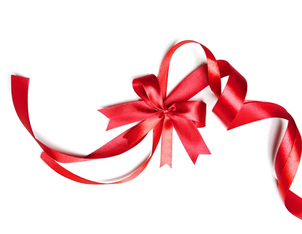 Shiny red ribbon with bow isolated on white — Stock Photo, Image
