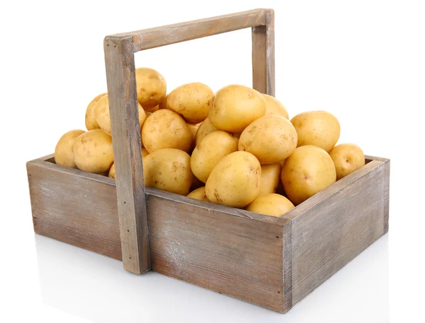 Batatas novas em mesa de madeira isoladas em branco — Fotografia de Stock