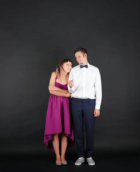 Young couple on black — Stock Photo, Image