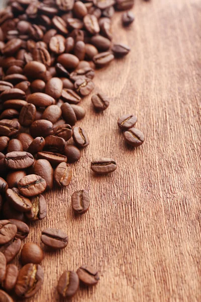 Coffee beans on wooden background — Stock Photo, Image