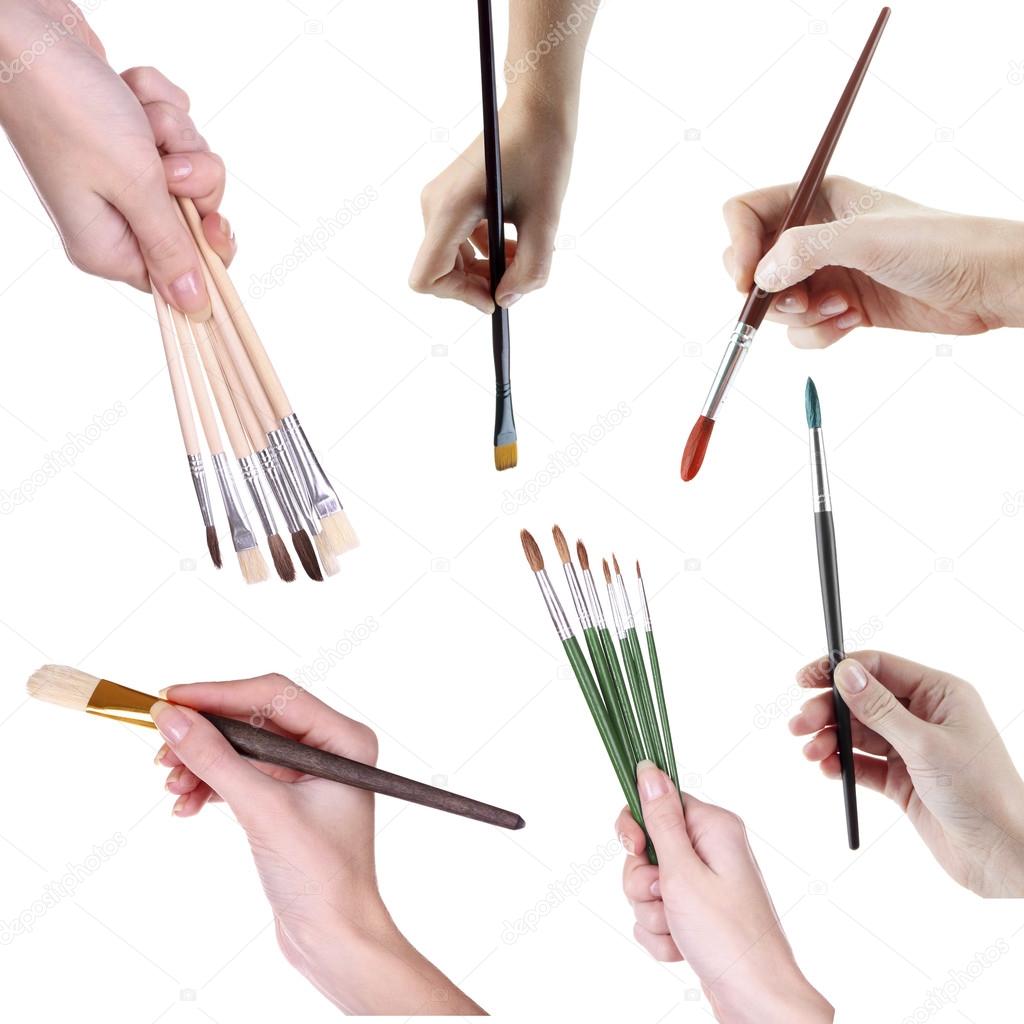 Different paintbrushes in hands