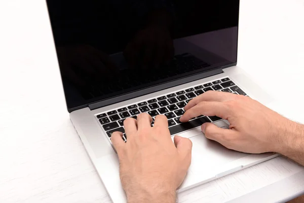 Young man with laptop — Stock Photo, Image