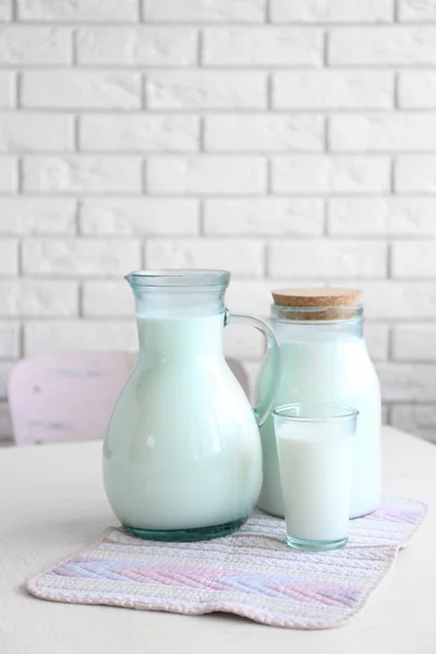 Pitcher, jar and glass of milk — Stock Photo, Image