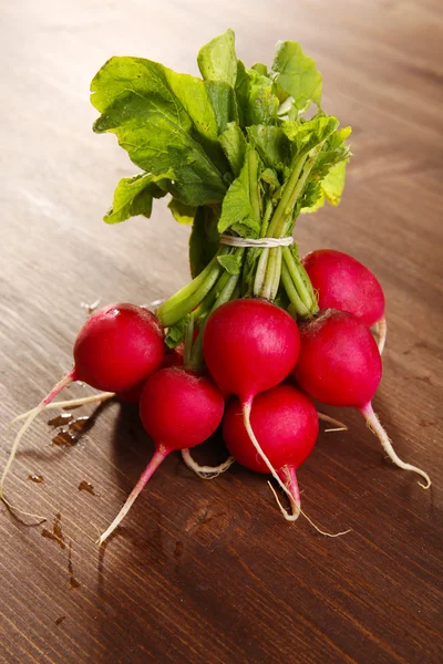 Bunch of radishes on wooden background — Stock Photo, Image