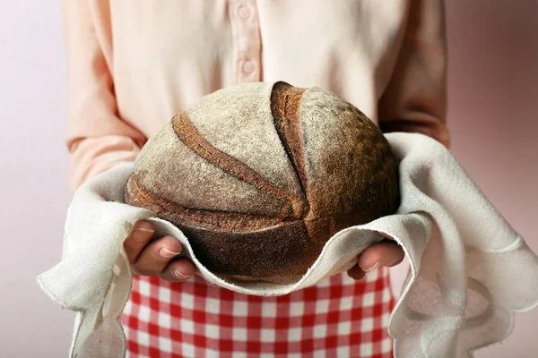 Woman holding tasty fresh bread, close up — Stock Photo, Image