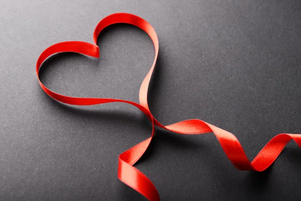 Red ribbon in shape of heart