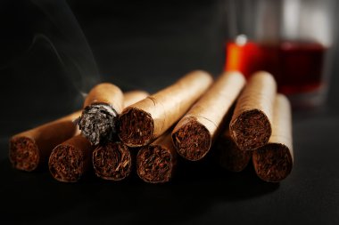 Group of cigars and burning clipart