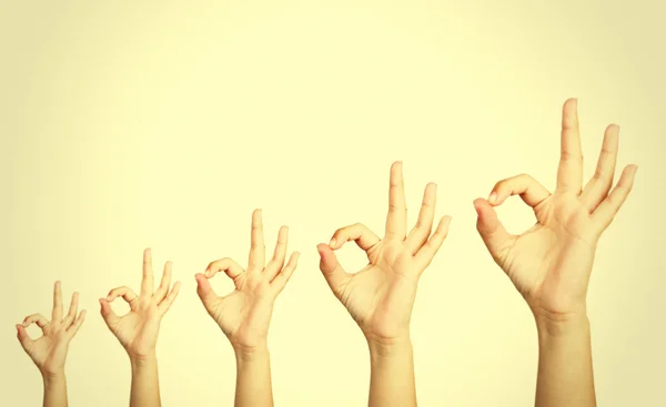 People's hands on light background — Stock Photo, Image