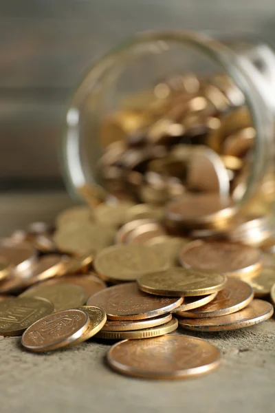 Glass jar with coins — Stock Photo, Image